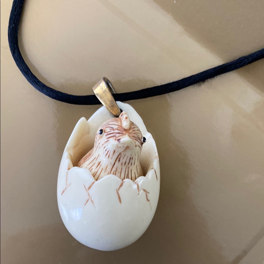 This an original RAZZI egg with chick TOTAL CONVERSATION PIECE